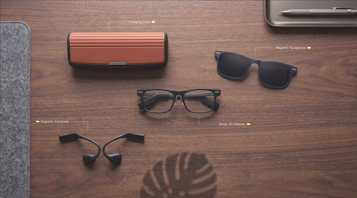 The full package of DEEPLUM F1 smart glasses put on the desk.