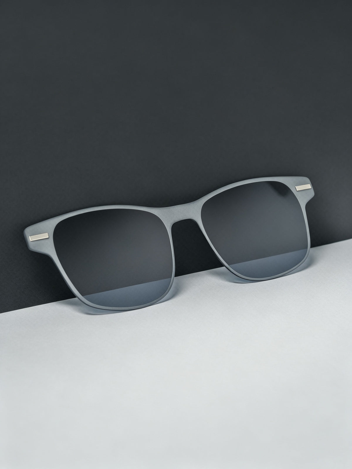 close-up of the magnetic sunglasses lens put on the desk.